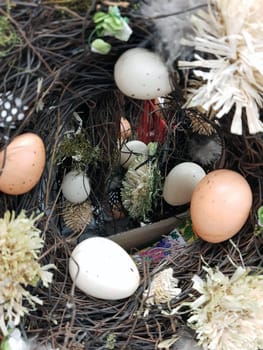 On the eve of Easter, festive decorations in the form of colorful Easter eggs and decorative greenery.