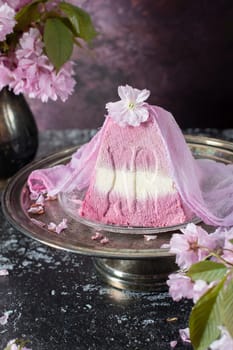 sweet curd orthodox easter on the background of purple sakura flowers, traditional food, sweet home, High quality photo