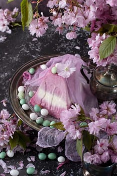 sweet curd orthodox easter on the background of purple sakura flowers, traditional food, sweet home, High quality photo