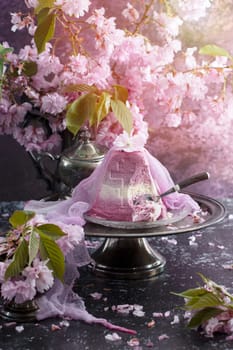 Traditional Easter Orthodox curd cake with blueberry. Traditional Easter curd cake with sakura flowers, woman decorating food, High quality photo