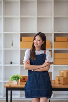 Starting Small business entrepreneur SME freelance, Portrait young woman working at home office, BOX, smartphone, laptop, online, marketing, packaging, delivery, b2b, SME, e-commerce concept