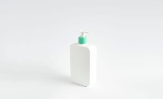 Large white plastic bottle with pump dispenser as a liquid container for gel, lotion, cream, shampoo, bath foam on white background