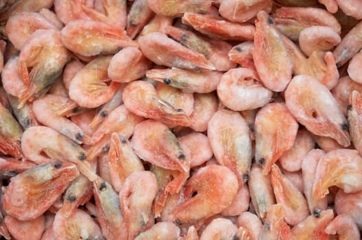 Frozen shrimp in fridge at the fish market. Healthy eating and fish market concept