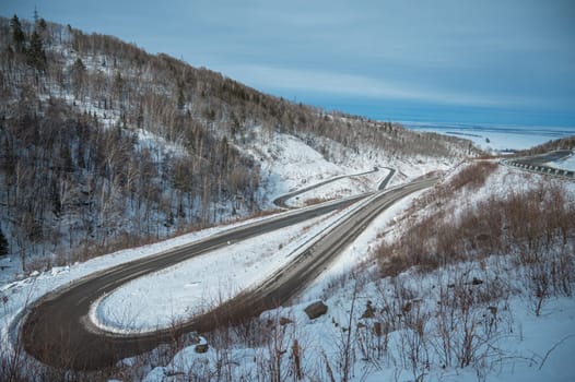 Winter serpentines road in Belokurikha, Siberia. Sunny winter day.