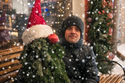 Man with fir tree decorated mannequin. Xmas holidays, New Year or Christmas concept