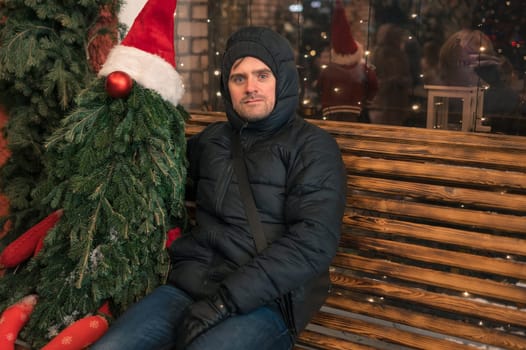 Man with fir tree decorated mannequin. Xmas holidays, New Year or Christmas concept