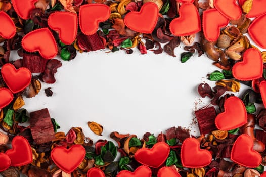 Different dry flowers with red hearts background. Valentines day or love concept