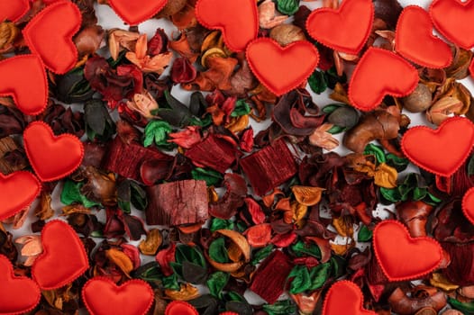Different dry flowers with red hearts background. Valentines day or love concept