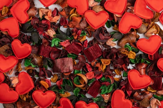 Different dry flowers with red hearts background. Valentines day or love concept