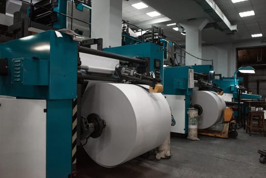 Printing house warehouse interior with printing machine
