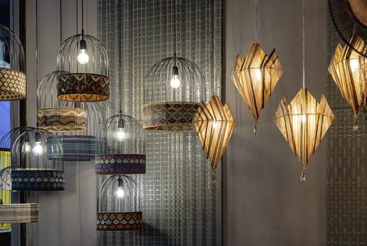 Bangkok,Thai - Apr 29, 2022 : Softly shining hanged lamps decor design for living room. Space for text, No focus, specifically.