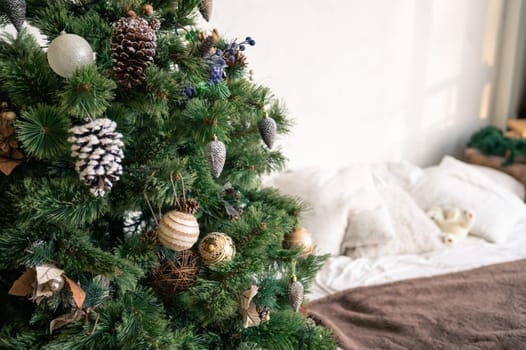 Christmas tree branch decorated with beauty balls and other christmas tree decoration