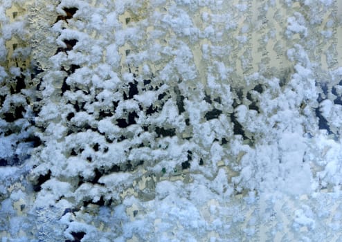 Frosted glass texture background. Abstract background from a window not evenly covered with snow.