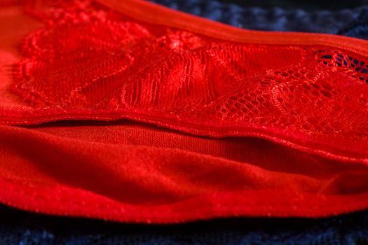 Lace on a blue and red women s underpants close up