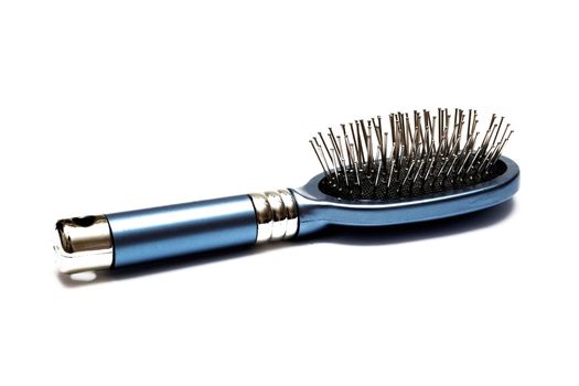 Blue metal hairbrush isolated on a white background