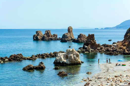 Pelion, Mourtia beach, Greece - August 15 2020: Mourtia Beach Pelion is a lovely beach on the south eastern side of Pelion, very close to the villages of Lyri and Katigiorgis. Considered among the best beaches of Pelion, Mourtia is found on the side of the Aegean Sea and has crystal clear waters.