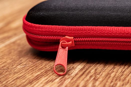 Blackclosed case for glasses on a wooden table