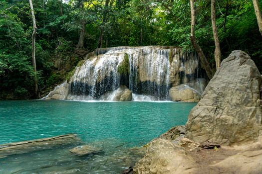 Clean green emerald water from the waterfall Surrounded by small trees - large trees,  green colour, Erawan waterfall, Kanchanaburi province, Thailand