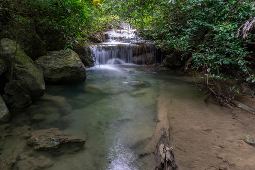 Clean green emerald water from the waterfall Surrounded by small trees - large trees,  green colour, Erawan waterfall, Kanchanaburi province, Thailand