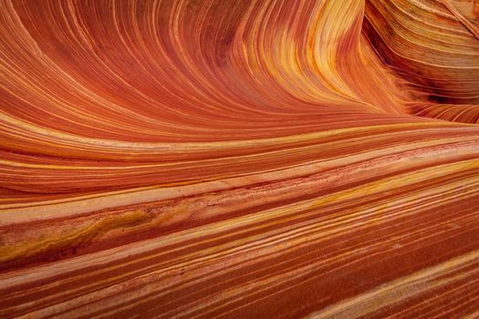 The Wave is a famous sandstone rock formation located in Coyote Buttes, Arizona, known for its colorful, undulating forms