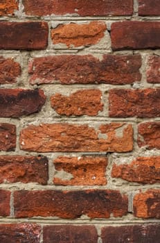 Texture of an old red brick wall. Background, texture. Vertical frame.