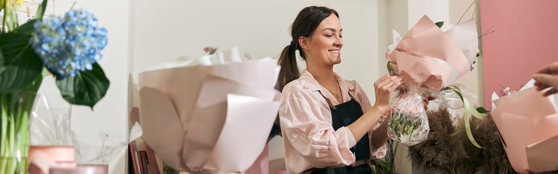 happy professional woman is working in flower shop