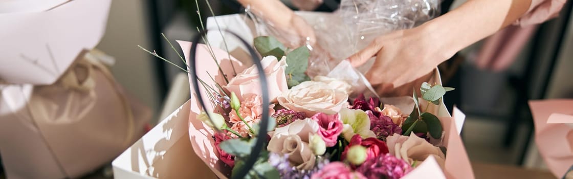 happy professional woman is working in flower shop