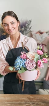 happy professional woman is working in flower shop
