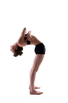 Slender flexible gymnast posing in studio, isolated on white