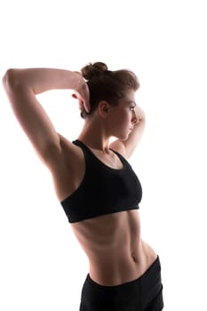 Portrait of sporty brunette posing in studio, isolated on white
