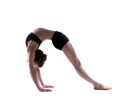 Image of young flexible girl in studio, isolated on white