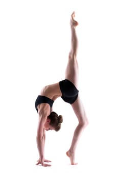 Young flexible brunette posing in studio, isolated on white