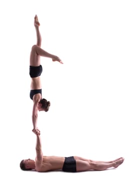 Image of couple two flexible acrobats posing in studio