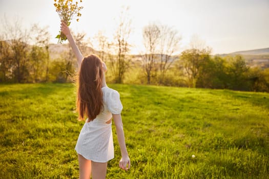 joyful girl at yellow rape seed meadow on sun set. High quality photo