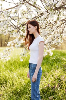 Young woman with cherry flowers portrait. High quality photo