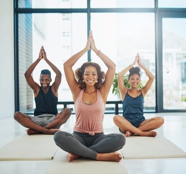 We practice yoga because it feels good. a group of people doing yoga