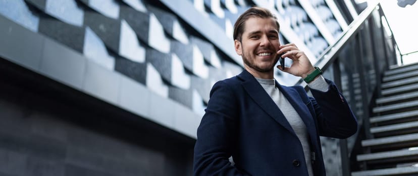 successful young architect on the background of the business center.