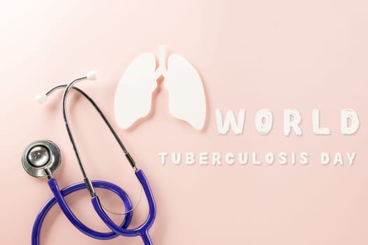 World Tuberculosis Day. Top view of lungs paper symbol and medical stethoscope on pink background, copy space, lung cancer awareness, concept of world TB day, Healthcare and medicine concept