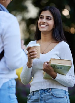 Smile, break or students talking at park on university campus for learning, education or books together. Girls talking, happy or students relax with coffee meeting for research or college knowledge.