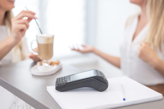 Close-up of a contactless payment terminal in a beauty salon