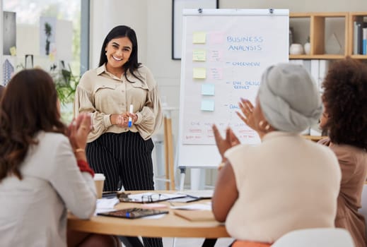 Business presentation, woman speaker and applause from women employee group from analysis data. Whiteboard, happy worker smile of cheering staff from collaboration and teamwork of working team.