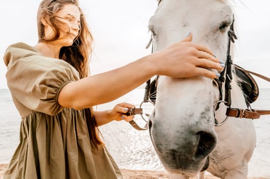 Happy woman and a white horse against the background of the sky and the sea