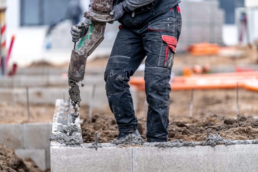 concreting the foundation of the house from the lost formwork.