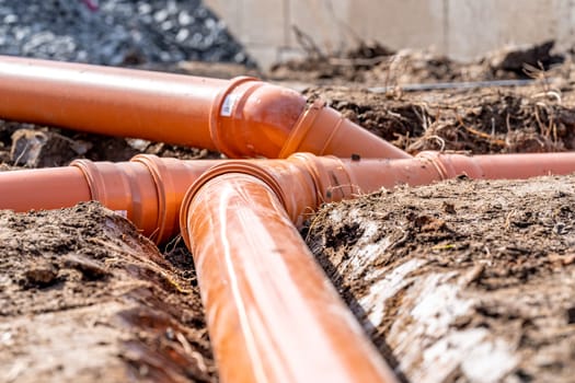 plastic pipe for sewage network in the base plate at the construction site.