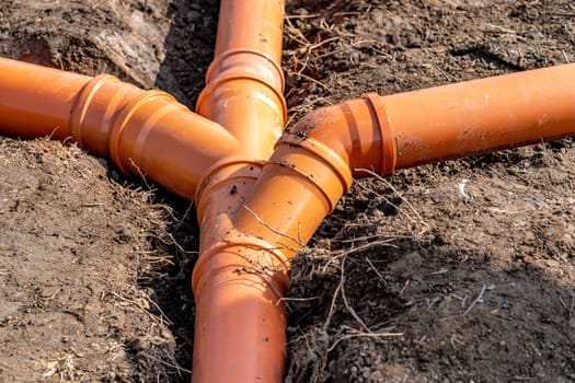 plastic pipe for sewage network in the base plate at the construction site.
