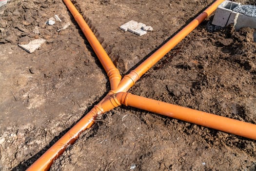 plastic pipe for sewage network in the base plate at the construction site.
