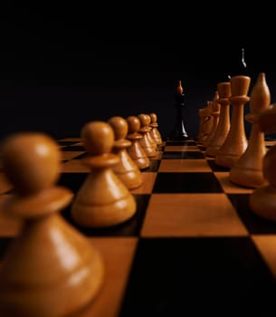 Selective focus on black King chess piece between white pieces on chess battlefield. Development analysis strategy plan. Leader and teamwork concept for success. Business solutions, success strategy