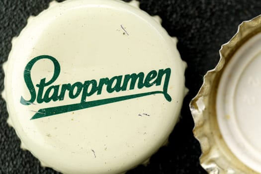 Tyumen, Russia-February 15, 2023: Staropramen bottle cap old beer logo close-up. Prague is the second largest brewery in the Czech Republic.