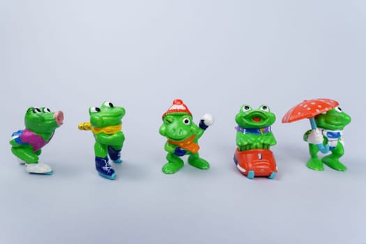 Tyumen, Russia-February 15, 2023: Kinder surprise toy frogs. Collection of kinder surprise toys.