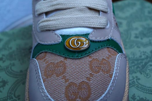 Tyumen, Russia-February 23, 2023: Gucci sneakers logo close-up. Stylish, fashionable Fashion concept